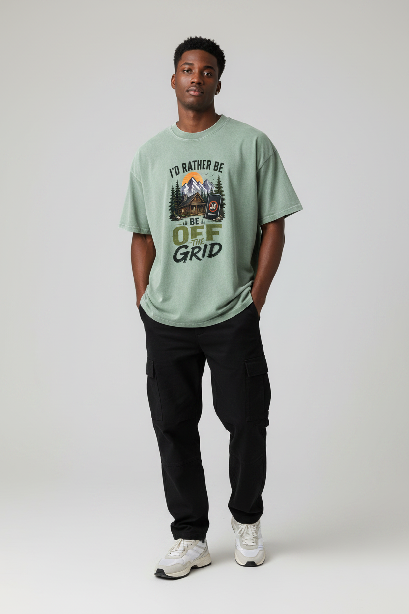 Male model wearing I'd Rather Be Off The Grid bean green snow washed oversized tee